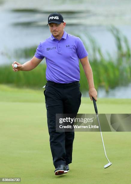 Matt Wallace of England reacts on the 18th hole during day one of Made in Denmark at Himmerland Golf & Spa Resort on August 24, 2017 in Aalborg,...