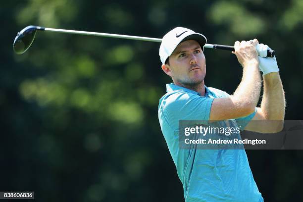 Russell Henley of the United States plays his shot from the 18th tee during round one of The Northern Trust at Glen Oaks Club on August 24, 2017 in...