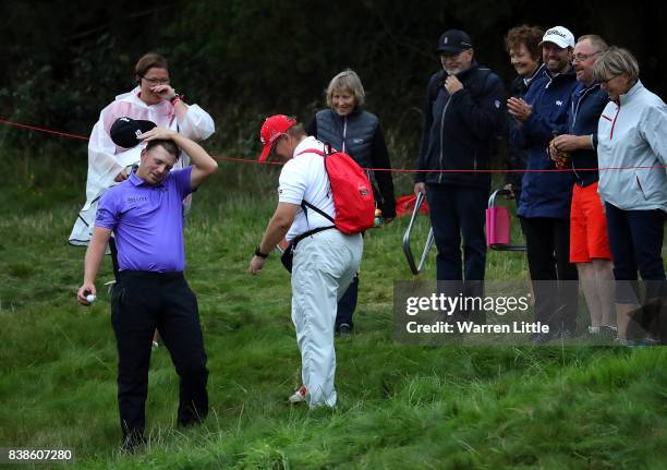 Matt Wallace of England looks relieved after finding his ball on the 18th hole during day one of Made in Denmark at Himmerland Golf & Spa Resort on...