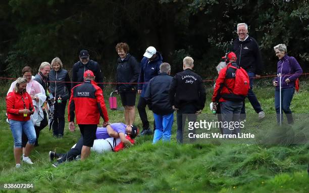 Matt Wallace of England hugs a marshall who found his ball on the 18th hole during day one of Made in Denmark at Himmerland Golf & Spa Resort on...