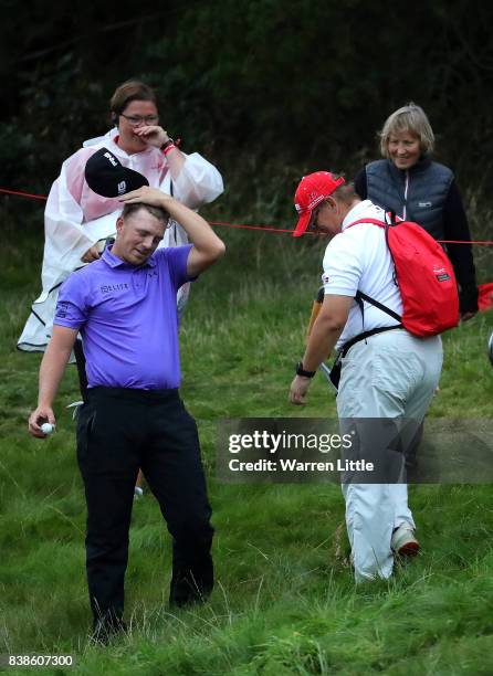 Matt Wallace of England looks relieved after finding his ball on the 18th hole during day one of Made in Denmark at Himmerland Golf & Spa Resort on...