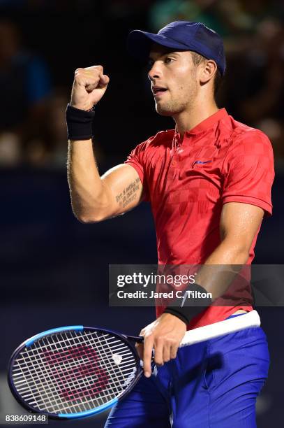 Borna Coric of Croatia reacts after winning his match against John Isner during the fifth day of the Winston-Salem Open at Wake Forest University on...