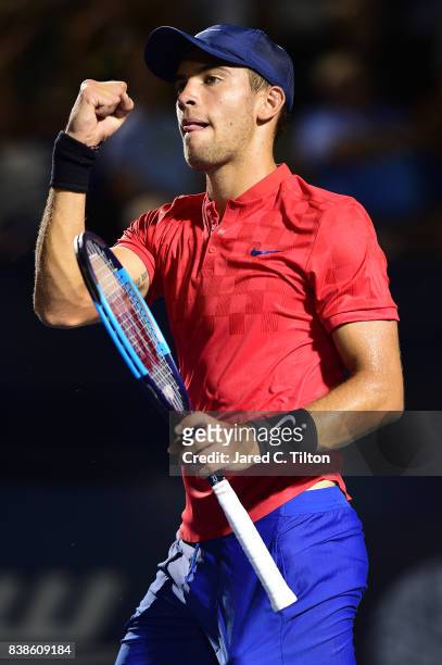 Borna Coric of Croatia reacts after winning his match against John Isner during the fifth day of the Winston-Salem Open at Wake Forest University on...