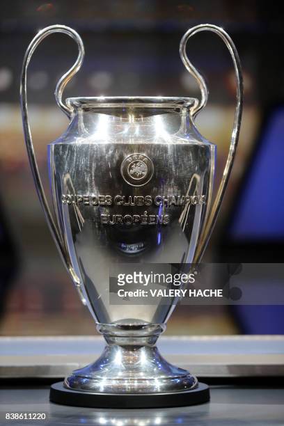 The Champions League Trophy stands on display during the UEFA Champions League football group stage draw ceremony in Monaco on August 24, 2017.