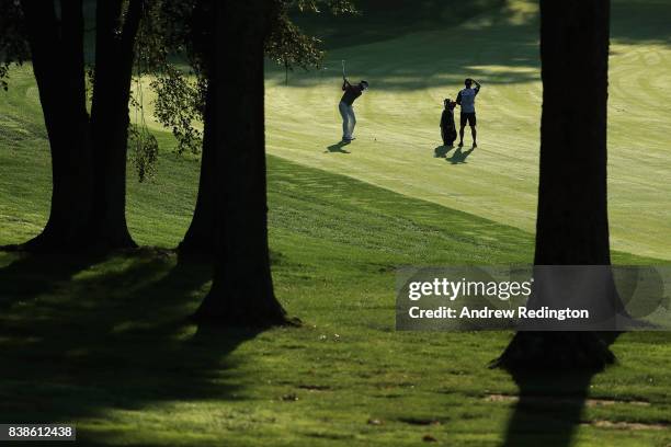 Kevin Na of the United States plays a shot on the tenth hole during round one of The Northern Trust at Glen Oaks Club on August 24, 2017 in Westbury,...