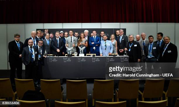 Attendees and award winners pose for a photograph after a press conference following the UEFA Champions League 2016/17 Group Stage Draw part of the...