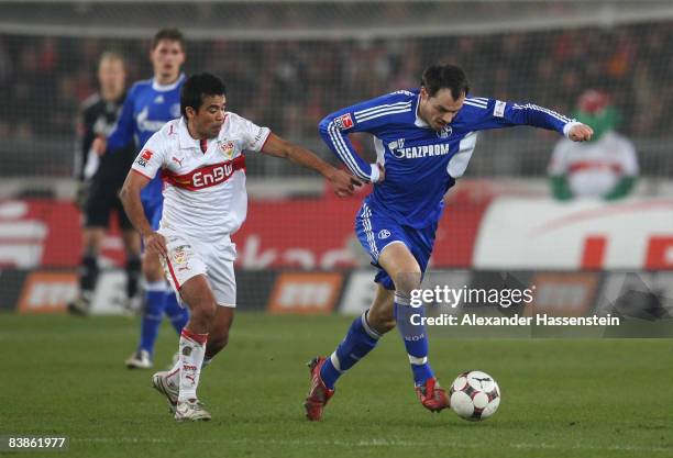 Ricardo Osorio of Stuttgart battles for the ball with Heiko Westermann of Schalke during the Bundesliga match between VfB Stuttgart and Schalke 04 at...