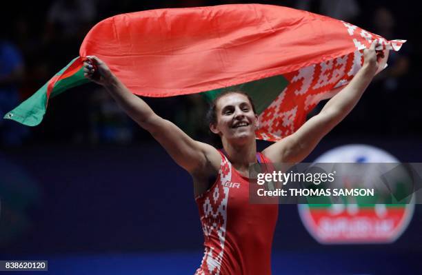 Belarus' Vanesa Kaladzinskaya celebrates after winning against Japan's Mayu Mukaida during the women's freestyle wrestling -53kg category final of...