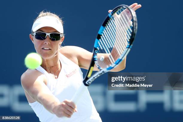 Kirsten Flipkens of Belgium returns a shot to Daria Gavrilova of Australia during Day 7 of the Connecticut Open at Connecticut Tennis Center at Yale...