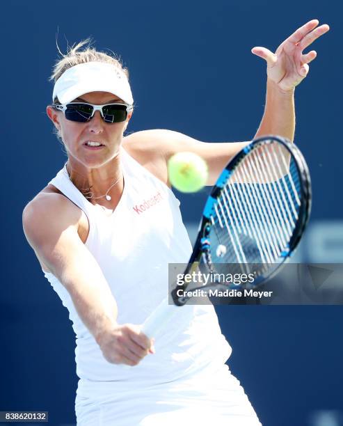 Kirsten Flipkens of Belgium returns a shot to Daria Gavrilova of Australia during Day 7 of the Connecticut Open at Connecticut Tennis Center at Yale...