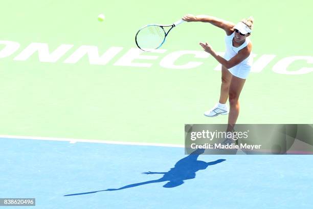 Kirsten Flipkens of Belgium serves to Daria Gavrilova of Australia during Day 7 of the Connecticut Open at Connecticut Tennis Center at Yale on...