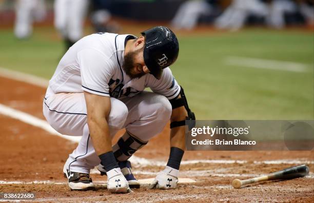 Steven Souza Jr. #20 of the Tampa Bay Rays reacts after being hit with a pitch by pitcher Tom Koehler of the Toronto Blue Jays to load the bases...