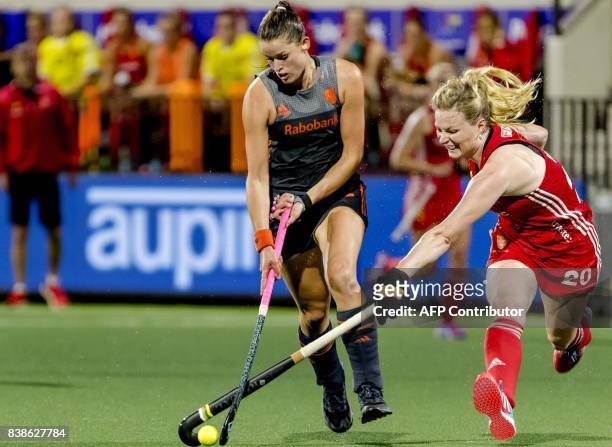 Lidewij Welten of The Netherlands fights for the ball with Hollie Web of England during the women's EuroHockey Championships match between the...