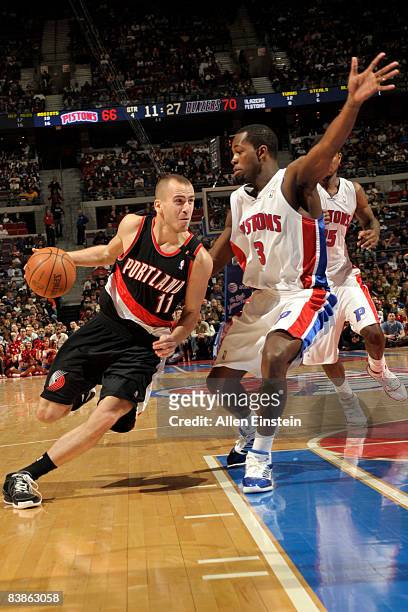 Sergio Rodriguez of the Portland Trail Blazers drives around Rodney Stuckey of the Detroit Pistons on November 30, 2008 at the Palace of Auburn Hills...