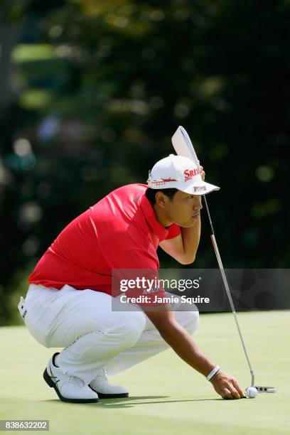 Hideki Matsuyama of Japan lines up a putt on the 18th green during round one of The Northern Trust at Glen Oaks Club on August 24, 2017 in Westbury,...