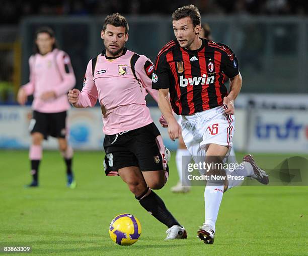 Antonio Nocerino of Palermo competes with AC Milan's Andrey Shevchenko during the Serie A match between Palermo and Milan at the Renzo Barbera Stadio...