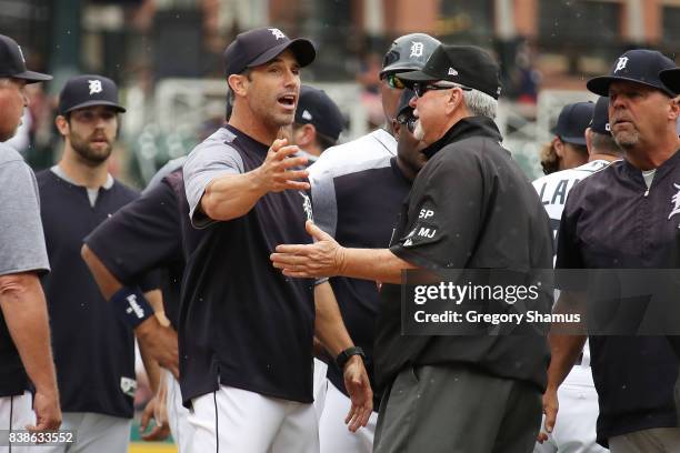 Manager Brad Ausmus of the Detroit Tigers argues with umpire Dana DeMuth after James McCann was hit int he had by a pitch in the seventh inning while...