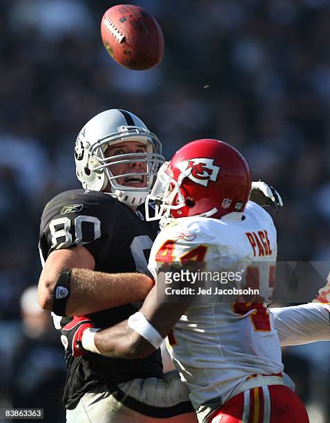 Jarrad Page of the Kansas City Chiefs breaks up a pass to Zach Miller of the Oakland Raiders during an NFL game on November 30, 2008 at the...
