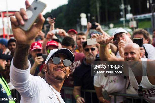 Lewis from Great Britain of team Mercedes GP taking a selfie with his fans during the Formula One Belgian Grand Prix at Circuit de Spa-Francorchamps...