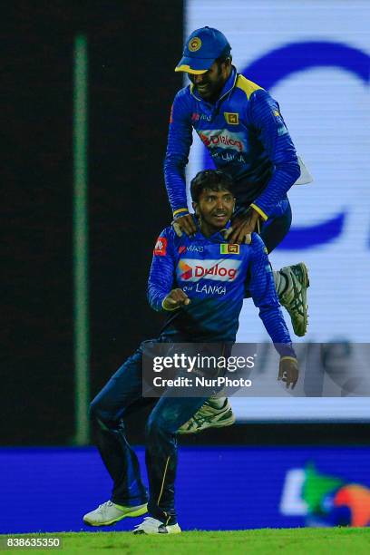 Sri Lankan cricketer and spinner Akila Dananjaya in celebration mood as he is joined by his captain Upul Tharanga during the 2nd One Day...