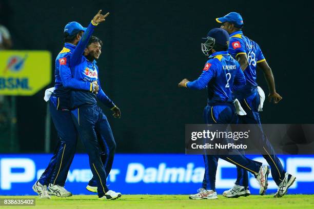 Sri Lankan cricketer and spinner Akila Dananjaya in celebration mood as he is joined by his team mates during the 2nd One Day International cricket...