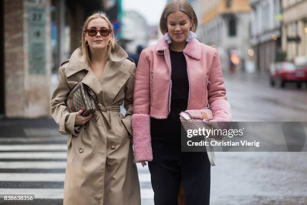 Guests wearing trench coat, pink leather jacket outside Bik Bok Runway Award on August 24, 2017 in Oslo, Norway.