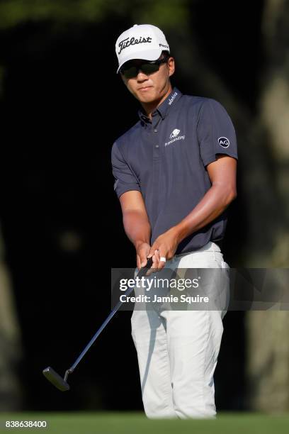 Michael Kim of the United States prepares to play a shot on the 14th hole during round one of The Northern Trust at Glen Oaks Club on August 24, 2017...