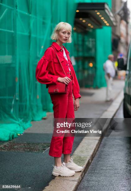 Model wearing red denim jacket, red cropped pants outside Bik Bok Runway Award on August 24, 2017 in Oslo, Norway.