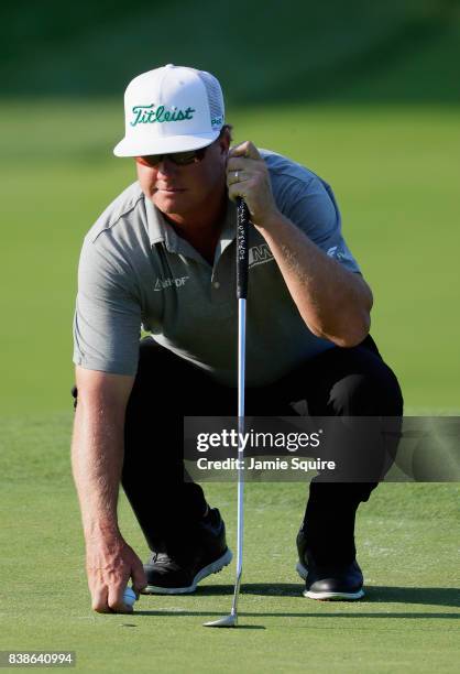 Charley Hoffman of the United States lines up a putt on the 17th green during round one of The Northern Trust at Glen Oaks Club on August 24, 2017 in...