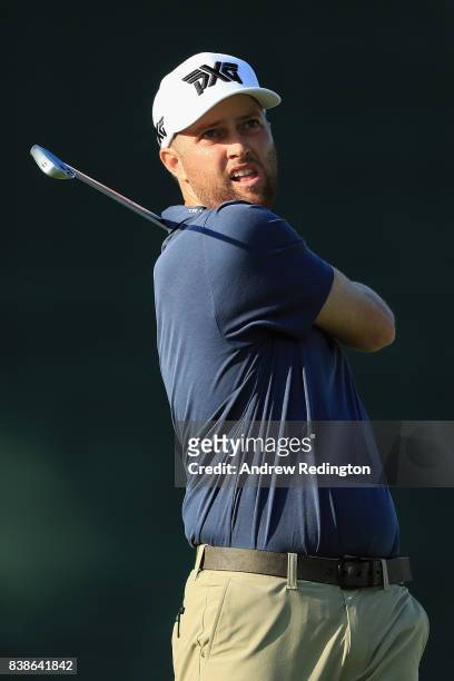 Chris Kirk of the United States plays his shot from the 17th tee during round one of The Northern Trust at Glen Oaks Club on August 24, 2017 in...