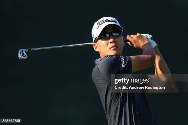 Michael Kim of the United States plays his shot from the 17th tee during round one of The Northern Trust at Glen Oaks Club on August 24, 2017 in...