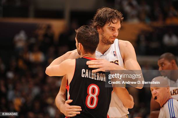 Pau Gasol of the Los Angeles Lakers and Jose Calderon of the Toronto Raptors greet each other before their game at Staples Center on November 30,...