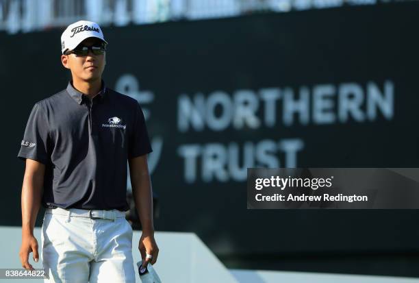 Michael Kim of the United States walks on the 17th hole during round one of The Northern Trust at Glen Oaks Club on August 24, 2017 in Westbury, New...