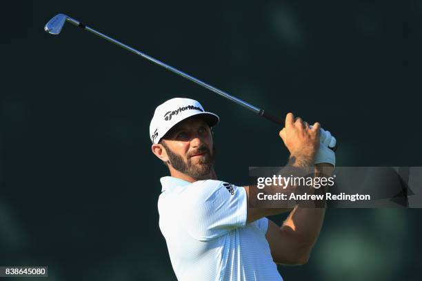 Dustin Johnson of the United States plays his shot from the 17th tee during round one of The Northern Trust at Glen Oaks Club on August 24, 2017 in...