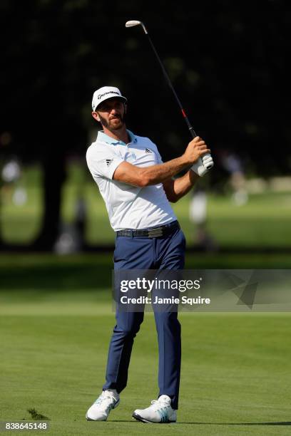 Dustin Johnson of the United States plays a shot on the 12th hole during round one of The Northern Trust at Glen Oaks Club on August 24, 2017 in...