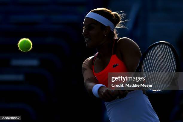 Dominika Cibulkova of Slovakia returns a shot to Anastasia Pavlyuchenkova of Russia during their match on Day 7 of the Connecticut Open at...