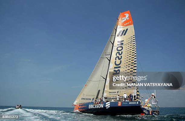 Crew members relax onboard as the Ericsson three yacht finishes in third place at Port Cochin in Kochi on December 1 in leg two of the Volvo Ocean...