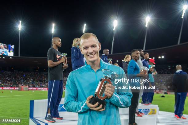 Sam Kendricks of the United States celebrates with diamond trophy during the Diamond League Athletics meeting 'Weltklasse' on August 24, 2017 at the...