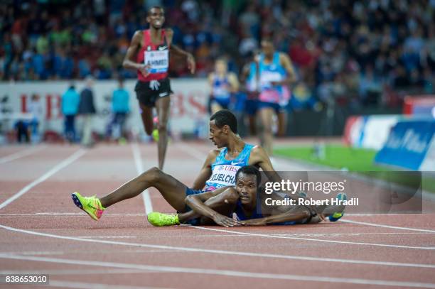 Muktar Edris of Ethiopia and Yomif Kejelcha of Ethiopia ends up on the track after finishing the 5000 metres men during the Diamond League Athletics...