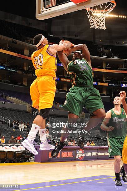 Antonio Meeking of the Reno Bighorns has his shot contested by Dwayne Mitchell of the Los Angeles D-Fenders at Staples Center on November 30, 2008 in...