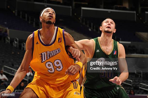 Rashid Byrd of the Los Angeles D-Fenders and Jesse Smith of the Reno Bighorns box out against each other during their game at Staples Center on...