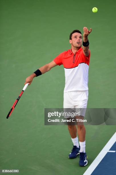 Roberto Bautista Agut of Spain serves to Taylor Fritz during their quarterfinals match of the Winston-Salem Open at Wake Forest University on August...