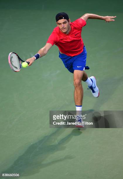 Taylor Fritz returns a shot to Roberto Bautista Agut of Spain during their quarterfinals match of the Winston-Salem Open at Wake Forest University on...