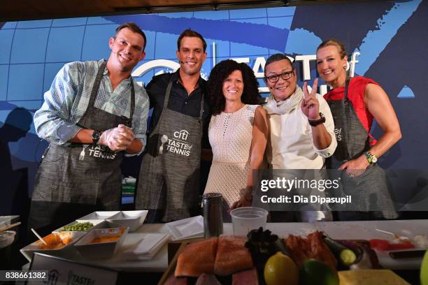 Tennis players Mike and Bob Bryan, Michele Imbasciani, Chef Masaharu Morimoto, and Lara Spencer give a cooking demo at the Citi VIP Lounge at Taste...