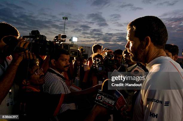 In this handout image provided by Volvo Ocean Race, Ericsson 4's skipper Torben Grael from Brazil is interviewed by the media on arriving at Port...