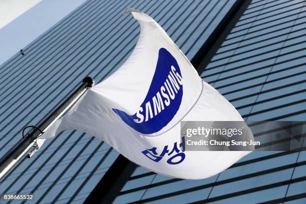 Samsung flag flies outside the Samsung office on August 25, 2017 in Seoul, South Korea. Prosecutors are seeking a 12-year jail sentence. Lee, de...