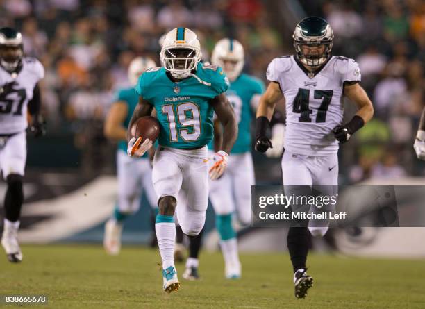 Jakeem Grant of the Miami Dolphins runs past Nathan Gerry of the Philadelphia Eagles to score a touchdown in the third quarter in the preseason game...