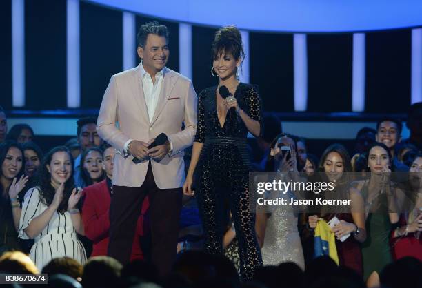 Daniel Sarcos and Carmen Villalobos on stage at Telemundo's 2017 "Premios Tu Mundo" at American Airlines Arena on August 24, 2017 in Miami, Florida.