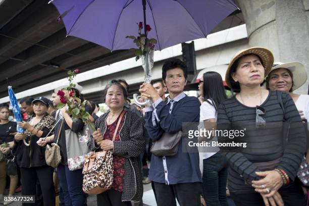 Supporters of former Thai prime minister Yingluck Shinawatra stand outside the Supreme Court in Bangkok, Thailand, on Friday, Aug. 25, 2017. A Thai...