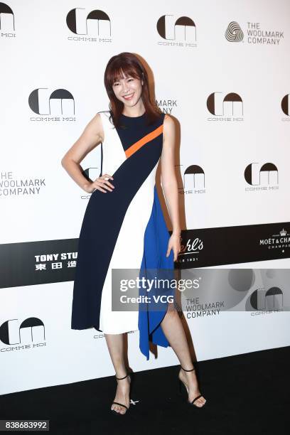 Model and hostess Li Ai arrives at the red carpet of Comme Moi Fashion Show Autumn/Winter 2017 on August 24, 2017 in Beijing, China.